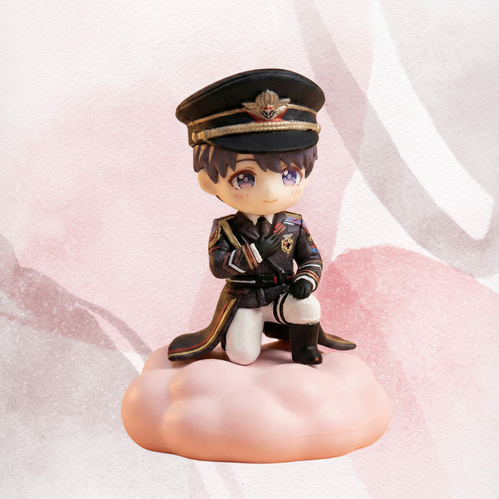 Figurine of Caleb from Love and Deepspace in a military uniform of the Farspace colonel on a pink cloud-like surface
